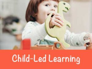 Toddler playing with dinosaur toy text reads Child-led learning